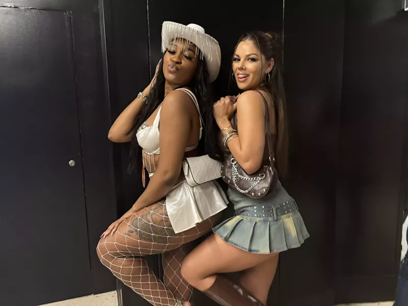 Image: Two women posing.