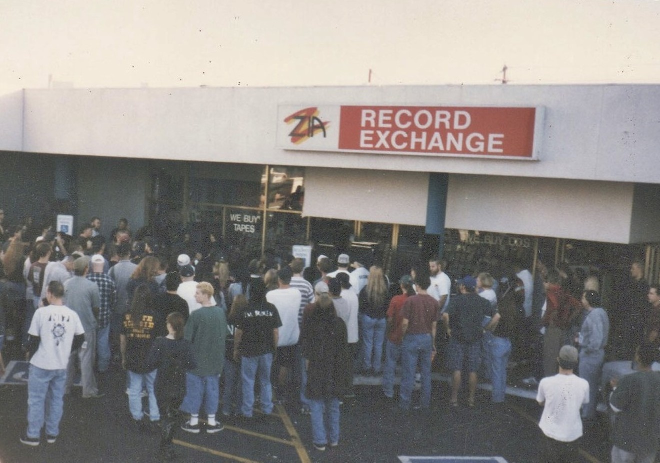 A crowd outside of the now-closed Zia Records at Seventh Avenue and Indian School Road.