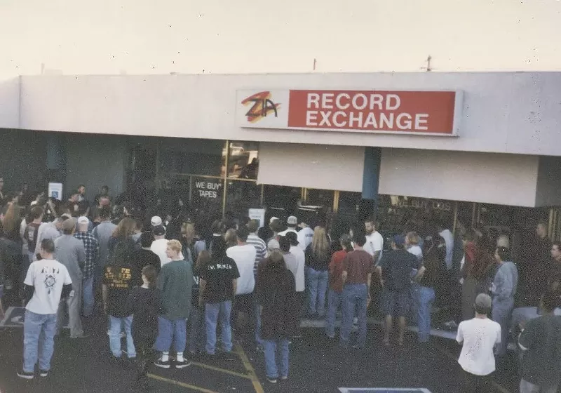 Image: A crowd outside of the now-closed Zia Records at Seventh Avenue and Indian School Road.