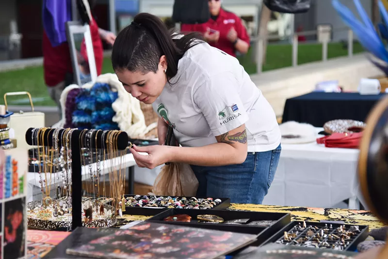 Image: Shoppers take a look at all the items available for sale.