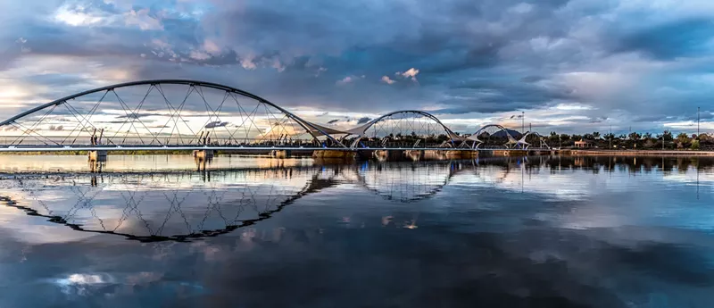 Image: The pedestrian bridge over Tempe Town Lake at sunset.