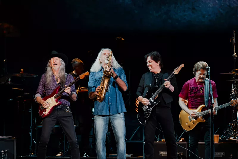 Image: A rock band performing.