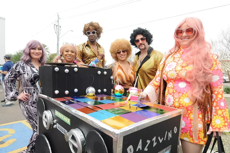 Image: The groovy folks behind the Dazzling Disaster Disco Balls team decorated their shopping cart like a sound system.