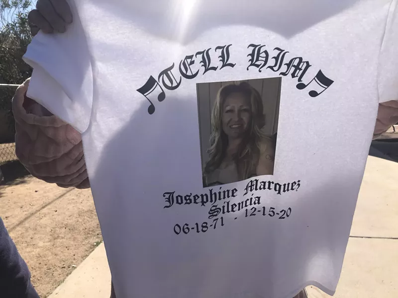 Image: Josephine Marquez, 85, holds a T-shirt made to honor her daughter, also named Josephine, following her death.