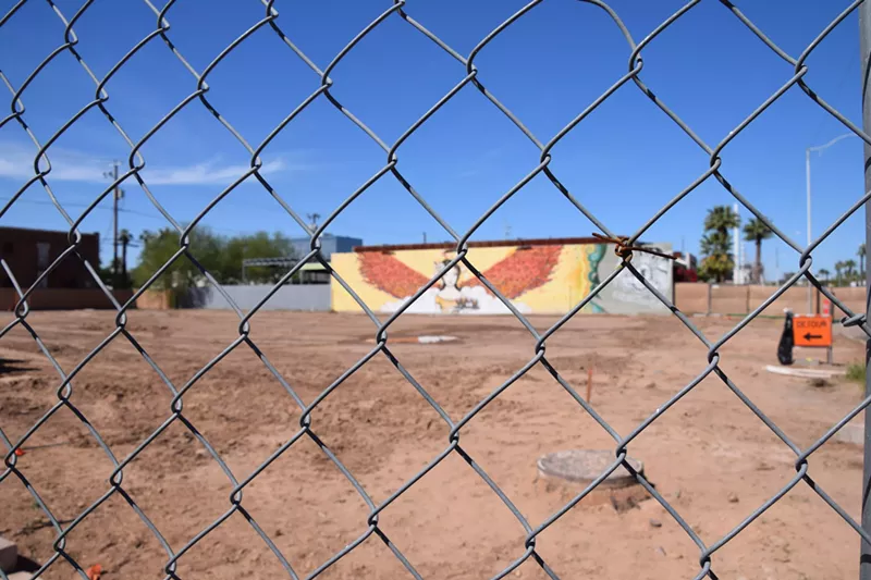 Image: Fencing surrounding the perimeter of The Derby lot in Roosevelt Row.