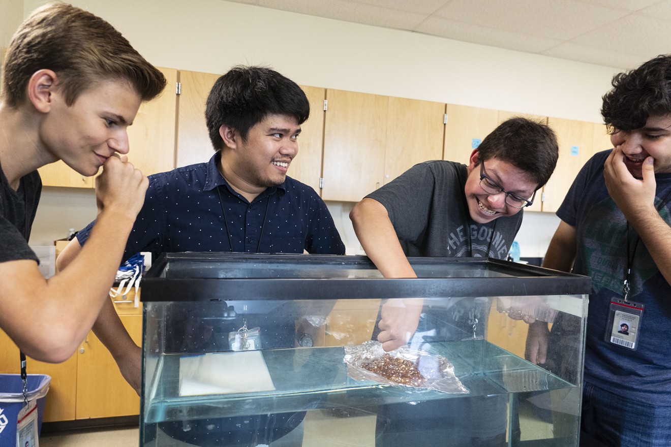 Melvin Inojosa, 29, second from left, conducts a physics experiment at Vista Grande. Inojosa is in the U.S. on a temporary J-1 cultural exchange visa.