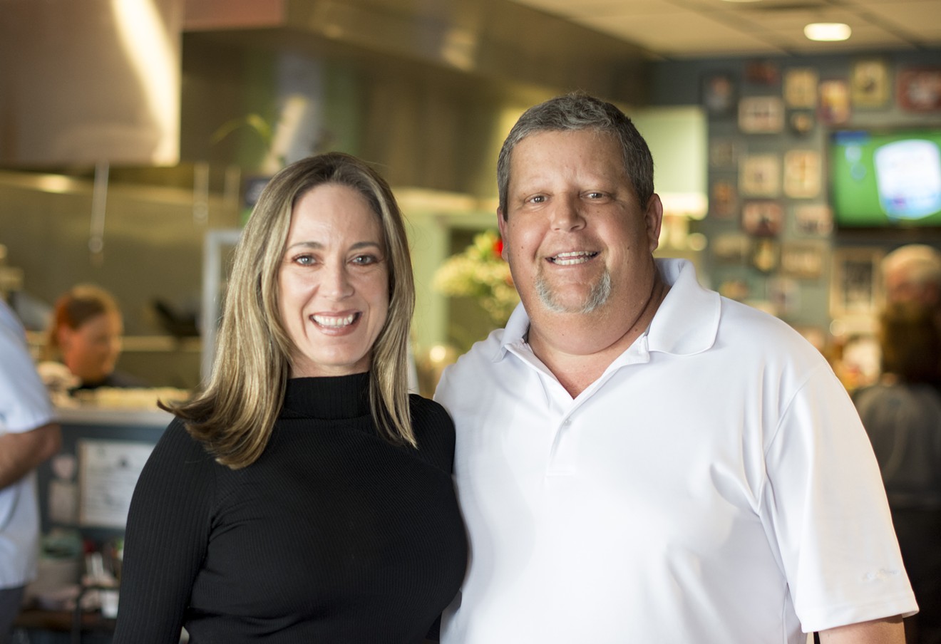 Jennifer Caraway and Mike La Brasca stand in The Joy Bus Diner. La Brasca volunteers for the organization founded by Caraway, delivering meals to homebound cancer patients once a week.