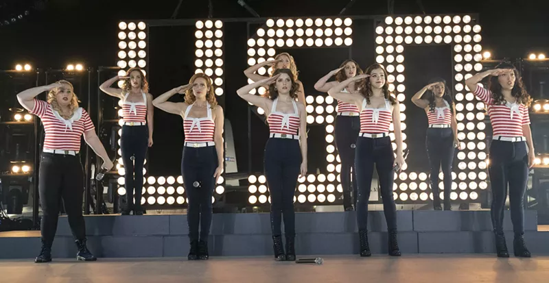 Image: The cast of Pitch Perfect 3 includes Rebel Wilson (left), Anna Kendrick (middle, front), and Anna Camp (middle, back) as the Bellas, the collegiate a cappella troupe from the first two films that joins a USO tour.