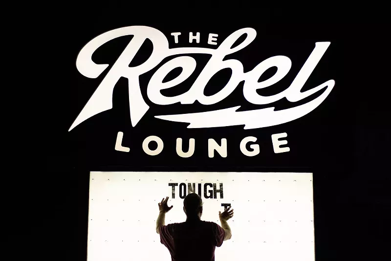 Image: An employee of The Rebel Lounge changes the letters on the venue's marquee in September 2023.