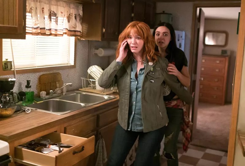 Image: Christina Hendricks (left) plays Cindy, the mother of a rebellious teenage daughter named Kinsey (Bailee Madison) in a family that gets terrorized by a murderous trio in The Strangers: Prey at Night.