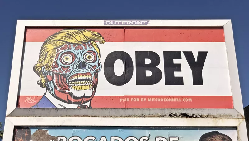 Image: The central Phoenix billboard featuring President Donald Trump as an alien from They Live.