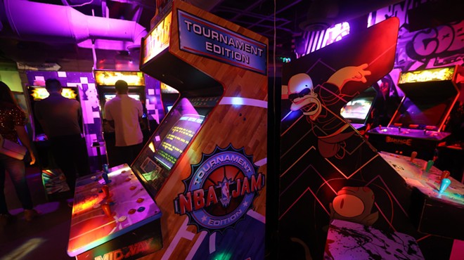 Old-school arcade game cabinets.