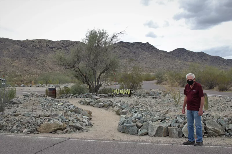 Image: Activist Jerry Van Gasse near a structure built from some of the homebuilder's excavated material donated to the park last year.