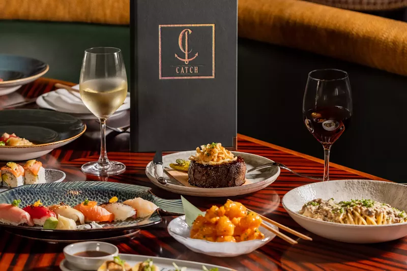 Image: Full table of dishes and drinks from Catch.