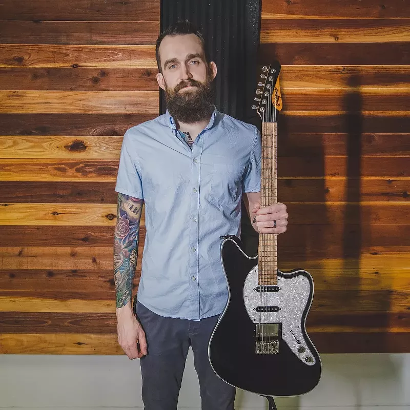 Image: Thomas with his new custom guitar.