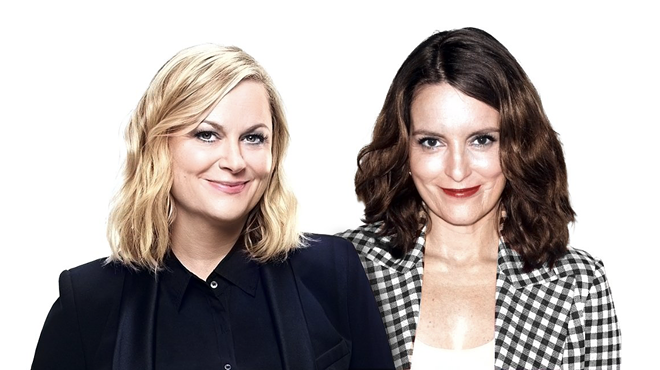 Two white women posing for the camera.