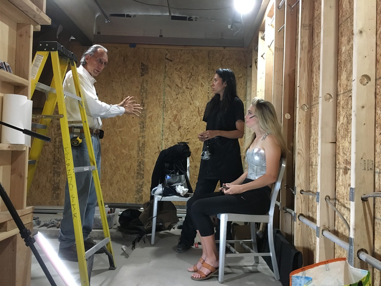 Local artist and accused serial harasser Bill Tonnesen talking with former employee Marrioth Alfonzo (center), the new manager of The Imaginarea, which opens Friday in the art space formerly known as The Lavatory.