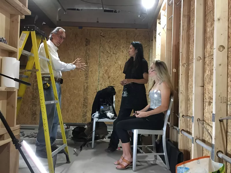 Image: Local artist and accused serial harasser Bill Tonnesen talking with former employee Marrioth Alfonzo (center), the new manager of The Imaginarea, which opens Friday in the art space formerly known as The Lavatory.