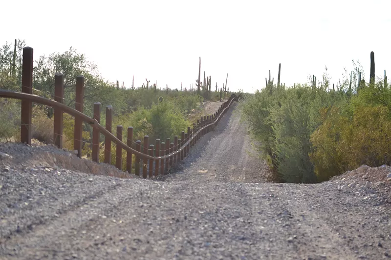 Image: The proposed wall would replace this and other vehicle barriers with 18- to 30-foot high steel bollards.
