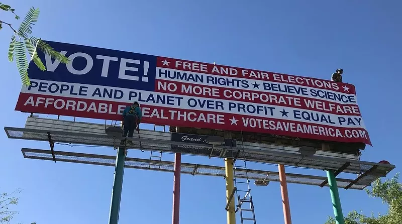 Image: Freshly installed VOTE! billboard by Karen Fiorito.