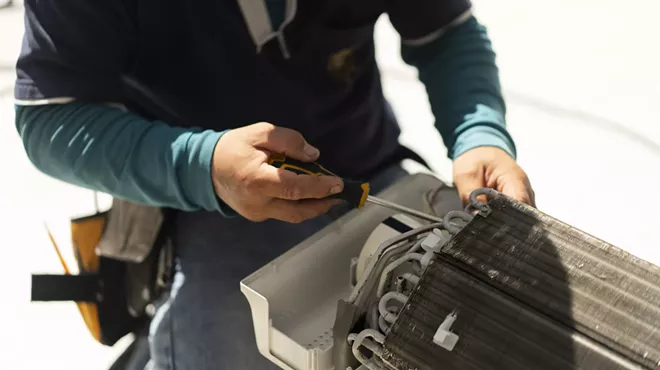 an HVAC repair person at work