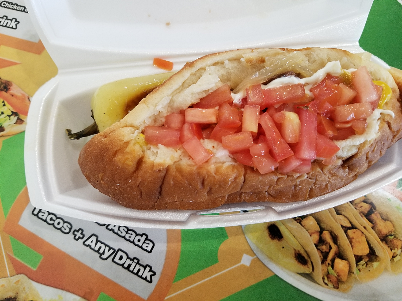 A Sonoran hot dog, with chile guero on the side, from the Phoenix location of El Guero Canelo.