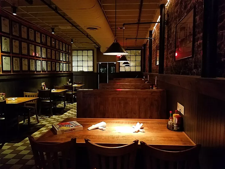 A wall now closes off the area that used to be a cafeteria-style open kitchen, and a gallery wall is neatly adorned with black-and-white portraits of notable Phoenix residents. - PATRICIA ESCARCEGA