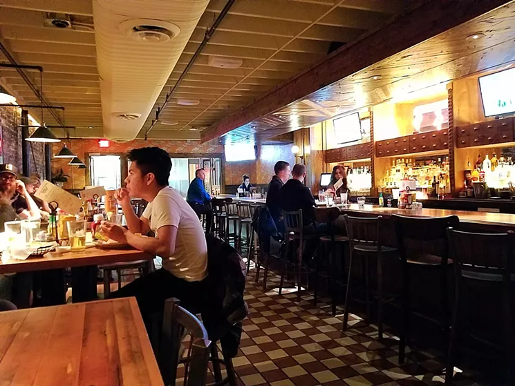 The Deli Tavern has a new oak bar and vintage-inspired design features like checkered floors and exposed brick walls. - PATRICIA ESCARCEGA