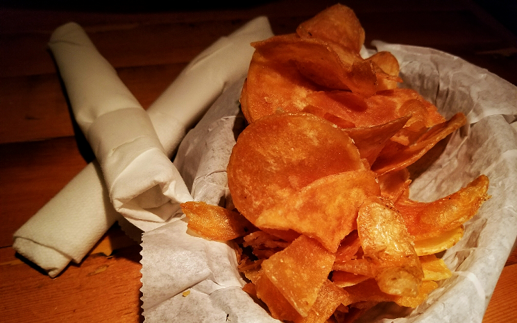 A visit to the Deli Tavern includes a complimentary basket of the restaurant's thick-cut potato chips. - PATRICIA ESCARCEGA
