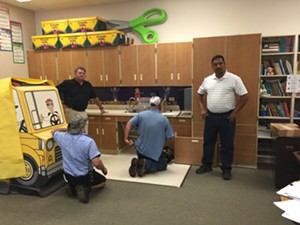 Mesa school district employees replace parts of Boileau-Stockfisch's classroom sink last summer. - COURTESY OF GENEVIEVE BOILEAU-STOCKFISCH