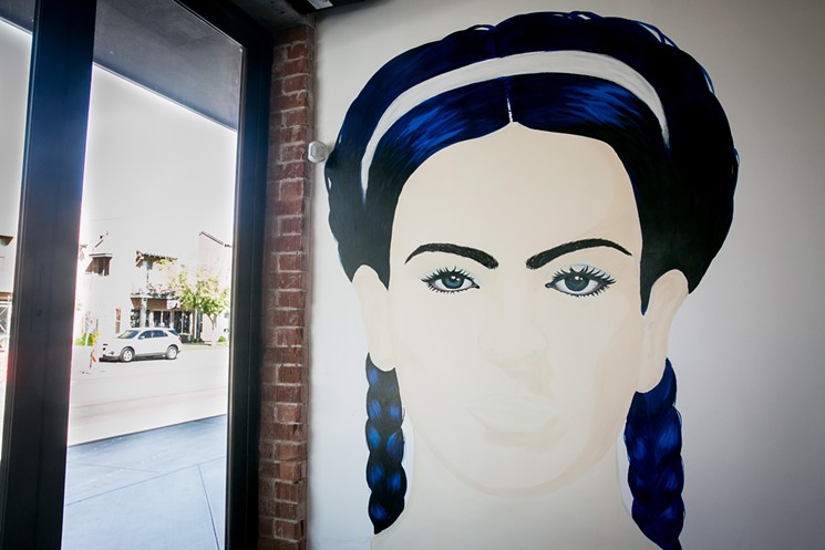 A projector will beam changing designs onto Garcia's Frida Kahlo painting. - MELISSA FOSSUM