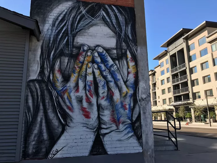 Hugo Medina's mural depicts an artist reacting to changes in the Roosevelt Row arts district. - LYNN TRIMBLE