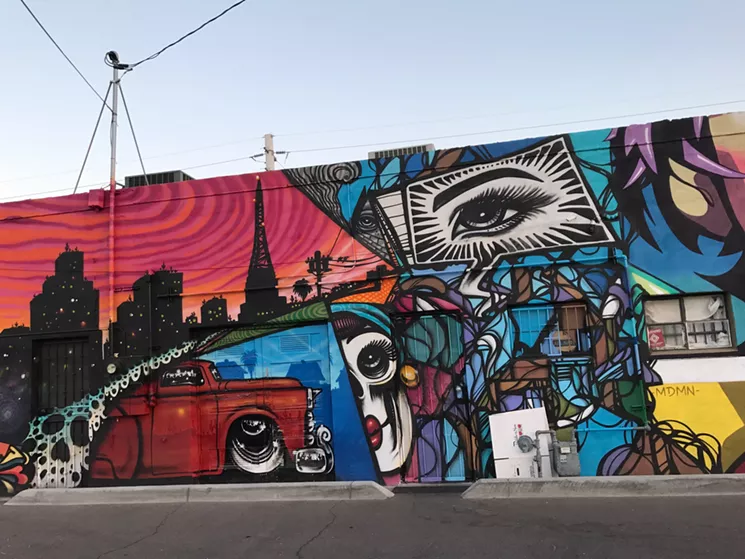 Lalo Cota's iconic car and skull imagery is part of a collaborative mural at Carly's Bistro. - LYNN TRIMBLE
