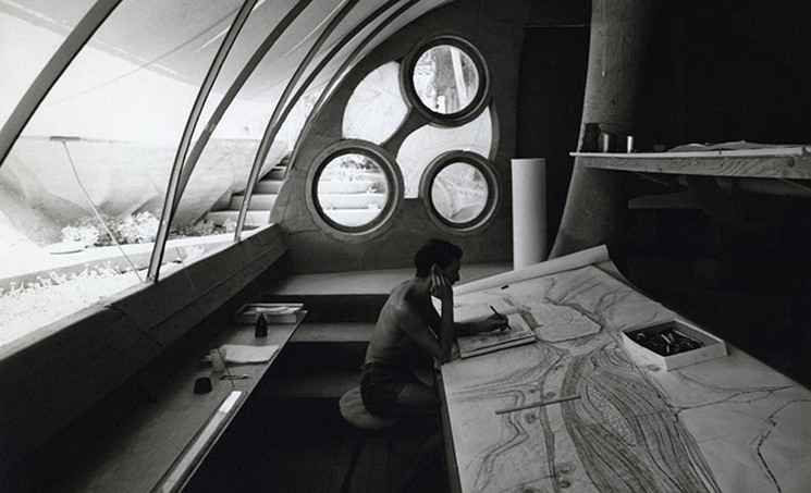 Stuart A. Weiner, [Soleri sketching at his desk, Cosanti], ca. 1960. Gelatin-silver print, 10 x 8 inches. Collection of the Cosanti Foundation. © The Weiner Estate - COURTESY OF SCOTTSDALE MUSEUM OF CONTEMPORARY ART