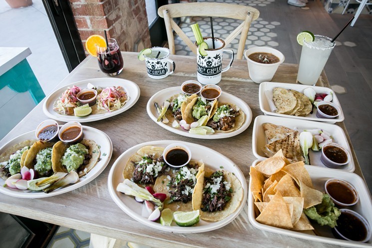 A spread of food and drink at Taco Chelo. - MELISSA FOSSUM