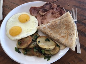 A breakfast plate featuring thin pork chops. - CHRIS MALLOY