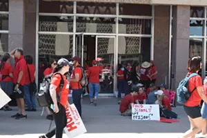 Although rally organizers moved up the start time, the temperature was climbing past 90 degrees on Friday. - JOSEPH FLAHERTY