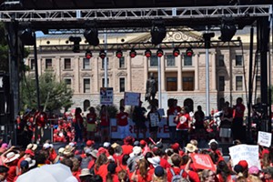 Leaders of #RedForEd group Arizona Educators United and the Arizona teacher's union on stage near the Capitol on Friday. - JOSEPH FLAHERTY