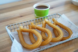 The Spaniard, with its thin, unsugared loops and accompanying hot chocolate, is perhaps the best dish at Dulce Churro Cafe. - MEAGAN MASTRIANI