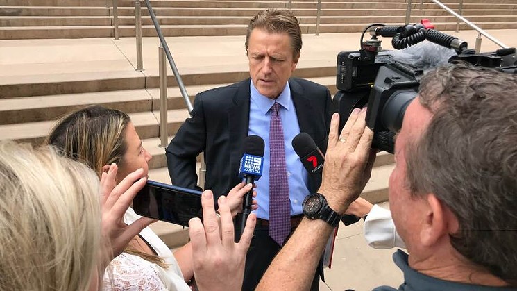 Defense lawyer Eric Kessler talks about the Sanaa Cunningham murder case with Australian media crews after a hearing in Maricopa County Superior Court Friday, October 12. - SEAN HOLSTEGE