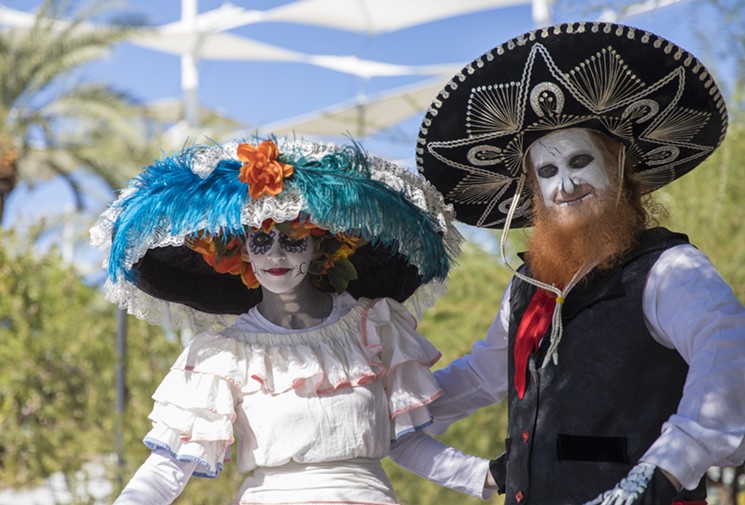 Dia de los Muertos festivities at Mesa Arts Center include stilt walkers. - MESA ARTS CENTER