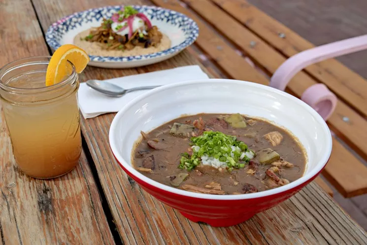 The new Welcome Diner's terrific trio: the hurricane cocktail, gumbo, and pork and grits (in the background). - JACKIE MERCANDETTI