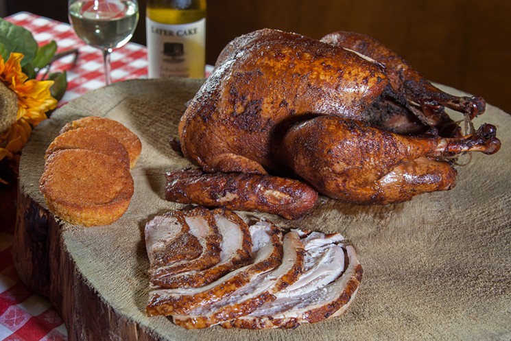 A 12- to 14-pound turkeys slow roasted over almond and mesquite wood is available for pickup at Bobby-Q's. - BOBBY-Q'S