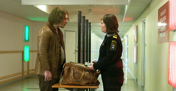Eva Melander (right) plays Tina, a quiet, somber Swedish customs guard working a border crossing, and Eero Milonoff is Vore, who awakens her desires while proclaiming that humans are worthless parasites, in Ali Abbasi’s Border. - CHRISTIAN GEISNAS