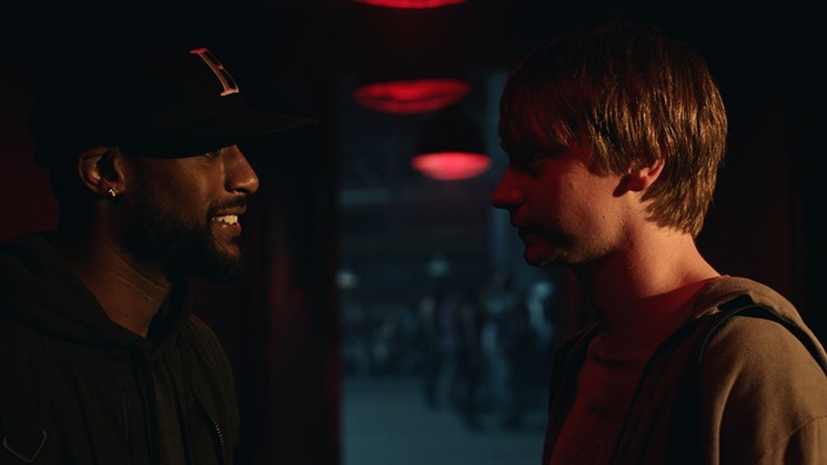 Calum Worthy (right) plays grad student Adam Merkin, who gets hooked on battle-rap competitions after consulting with a master named Behn Grymm (Jackie Long), in director Joseph Kahn's Bodied. - COURTESY OF YOUTUBE ORIGINALS AND NEON