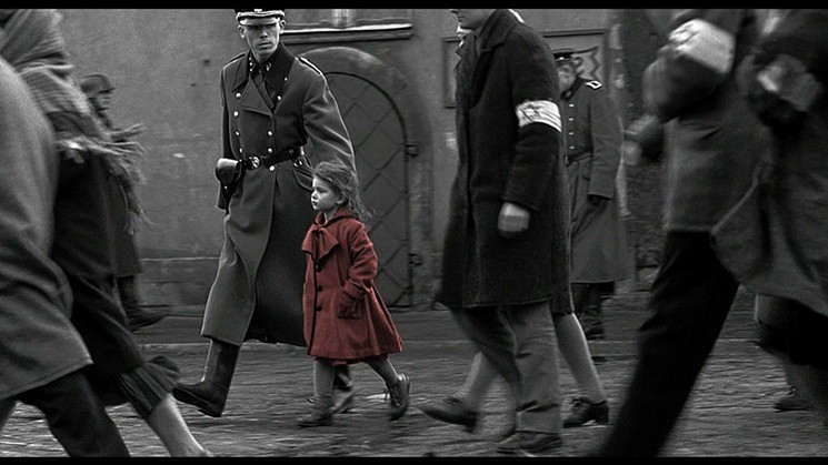 The fate of  the little girl in the red coat, played by Oliwia Dabrowska, was one of the gripping storylines in Schindler's List, Steven Spielberg’s 1993 Holocaust epic that is returning to the big screen in honor of the 25th anniversary of its release. - COURTESY OF UNIVERSAL PICTURES