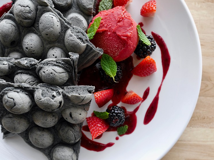 The Goth Waffles is made with activated charcoal and topped with fresh fruit. - SAM MCGEE