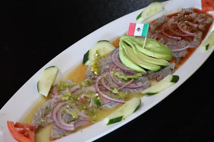 The Aguachiles Bandera at Mariscos El Rey is served with green, red, and white sauce. - JORDYN CRAWFORD