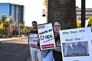 Protesters against Arizona Public Service gathered Thursday night outside the Phoenix Art Museum. - ELIZABETH WHITMAN
