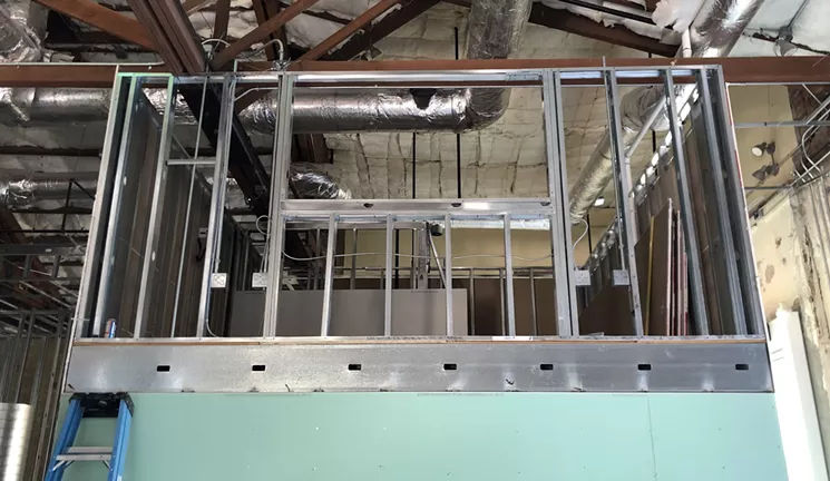 The crow's nest-style DJ booth under construction in the bar area of Track Club. - BENJAMIN LEATHERMAN